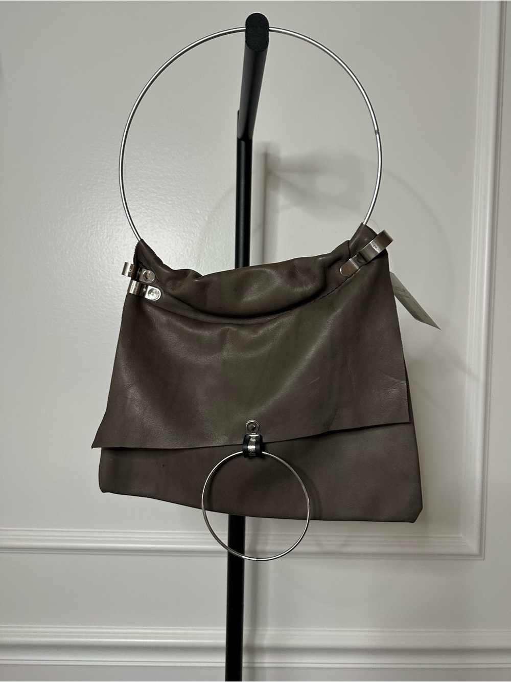 Unique Genuine Leather Handbag with ring handle.